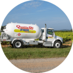 Quality Oil propane truck on a field