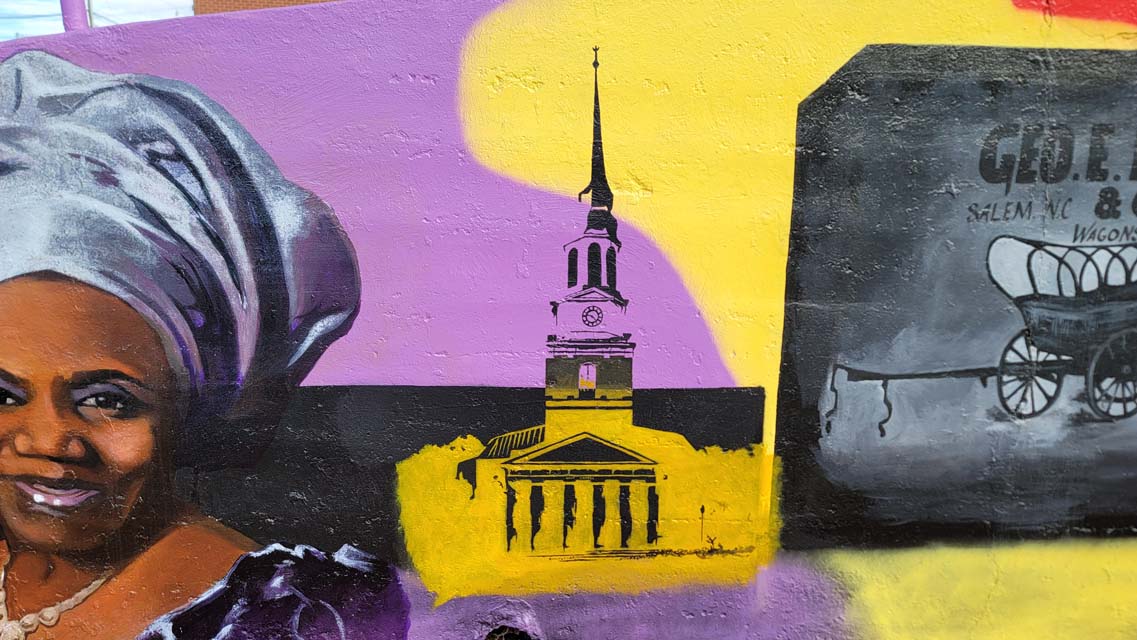 A mural painting of the wait chapel at wake forest.